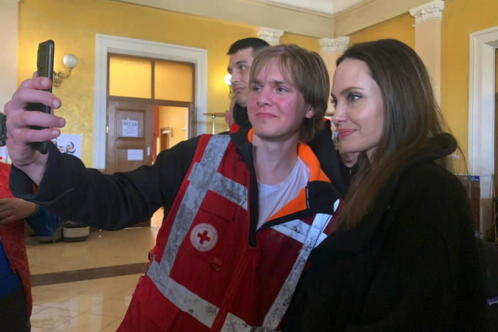 Angelina Jolie, Hollywood movie star and UNHCR goodwill ambassador, poses Saturday for photo with her fans in Lviv, Ukraine.