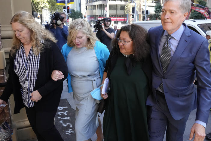 Steve Johnson with his sisters, Terry, left, and Rebecca and his wife Rosemarie, second right, arrive at the Supreme Court in Sydney on Monday for a sentencing hearing in the murder of Scott Johnson — Steve, Terry and Rebecca's brother.