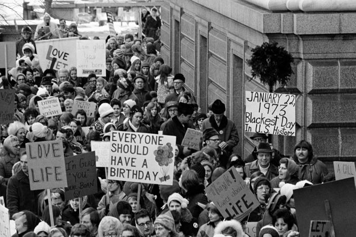 People march around the Minnesota Capitol building protesting the U.S. Supreme Court's Roe v. Wade decision in St. Paul, Minn., in January.