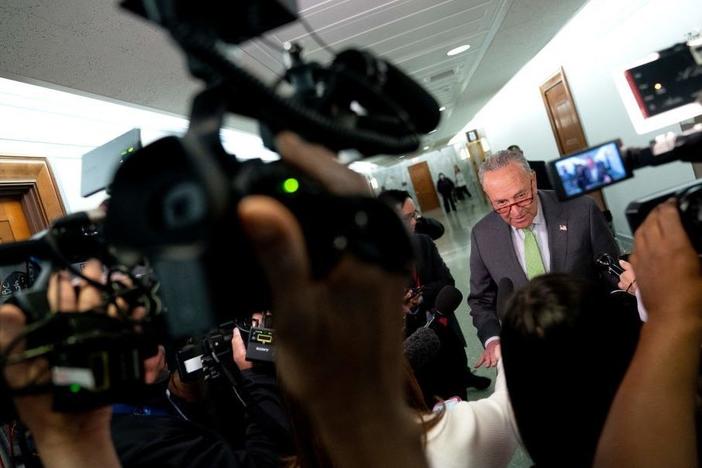 Senate Majority Leader Chuck Schumer, D-N.Y., speaks to reporters April 27 outside the Senate Judiciary Committee on Capitol Hill in Washington.