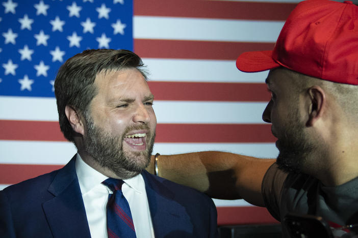 Ohio U.S. Senate candidate J.D. Vance greets a supporter Tuesday night at an election night event in Cincinnati after winning the Republican primary.