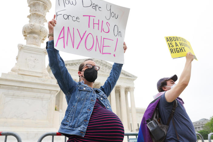 "Difficult to process the idea that you would force this on anyone — it's reprehensible; it should be a choice," Lindsey Bestebreurtje, who is 38 weeks pregnant and a resident of Arlington, Va., says outside the U.S. Supreme Court building on Tuesday.