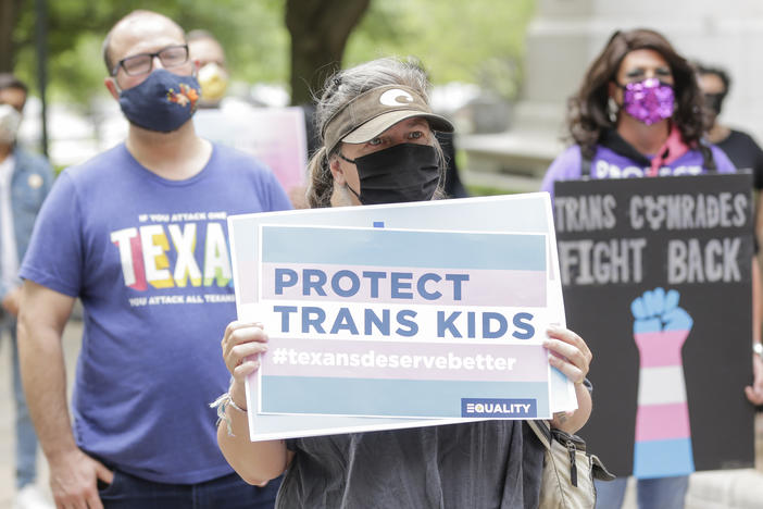 Protesters rally at the Texas State Capitol on May 4, 2021 in Austin to stop proposed medical care ban legislation that would criminalize gender-affirming care.