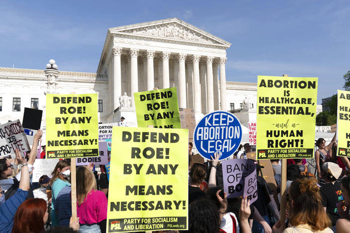 Demonstrators protest outside of the U.S. Supreme Court Tuesday, May 3, 2022 in Washington.