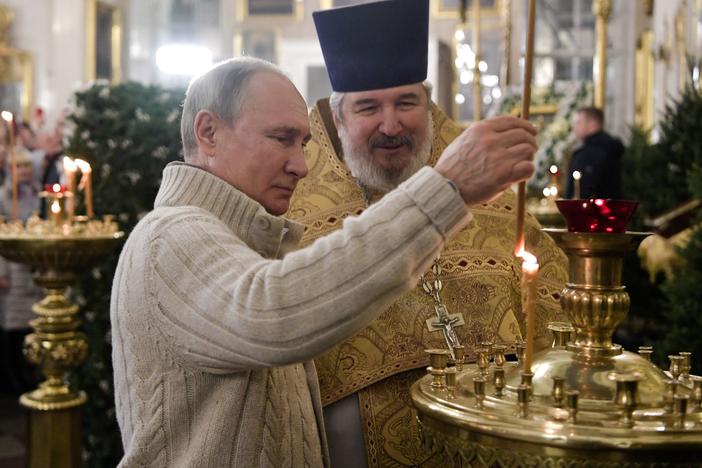 Russian President Vladimir Putin attends a Christmas liturgy at the Transfiguration Cathedral in St. Petersburg early on Jan. 7, 2020. In the U.S., Orthodox Christianity is a relatively small faith tradition, but in recent years, it has expanded to new regions. Some new converts are using the religion to spread white nationalist views.