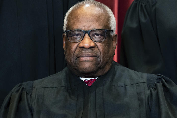 Justice Clarence Thomas sits during a group photo at the Supreme Court in Washington, on Friday, April 23, 2021.