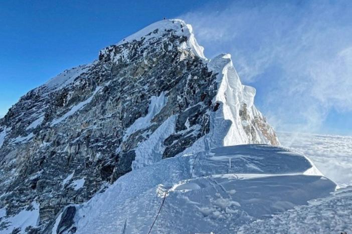 Kami Rita Sherpa climbed Mount Everest for the 26th time Saturday, setting a new world record for most times summitting the world's tallest peak.