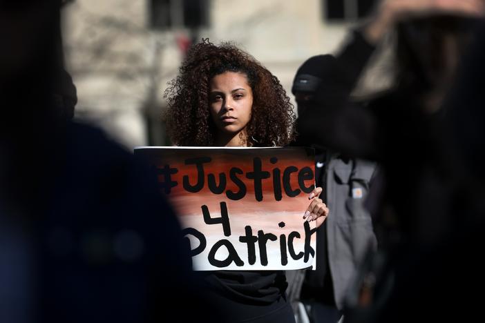 Supporters and family members of Patrick Lyoya, 26, participate in a rally in front of the Michigan state capital building to call on the Grand Rapids police department to name, arrest and prosecute the officer that shot Lyoya. Lyoya, an immigrant from the Democratic Republic of the Congo, died after being shot in the back of the head by a Grand Rapids police officer following a traffic stop.