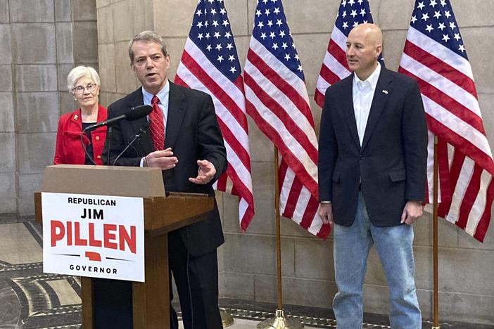 Jim Pillen, center, talks about his campaign after receiving an endorsement from Gov. Pete Ricketts, right, on Jan. 18 at the state Capitol in Lincoln, Neb. According to the AP, Pillen won the Republican primary May 10.