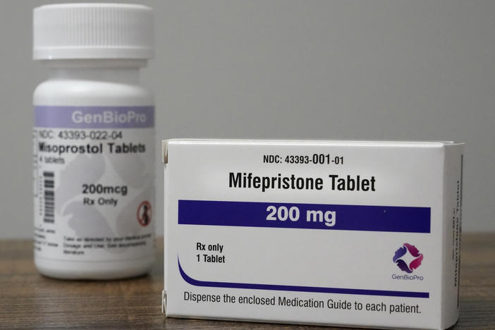 Containers of mifepristone and misoprostol — medications used to end a pregnancy — sit on a table inside of a Planned Parenthood clinic in Fairview Heights, Ill.
