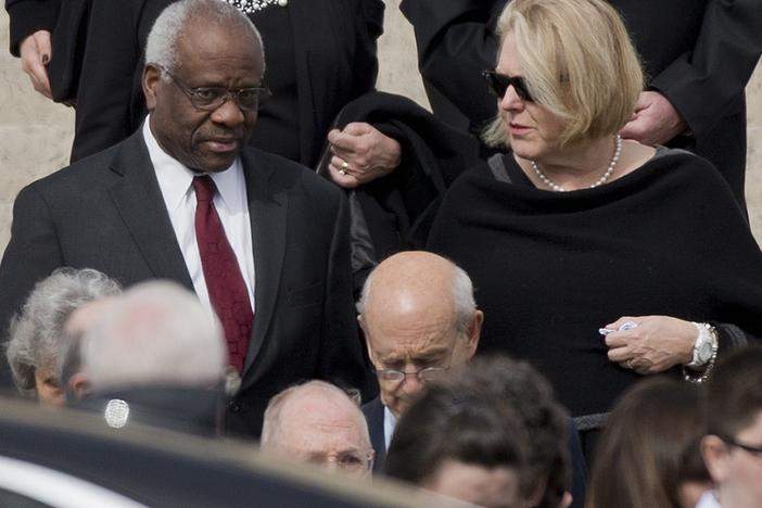 Supreme Court Associate Justice Clarence Thomas, left and his wife Virginia Thomas, right, leave the the Basilica of the National Shrine of the Immaculate Conception in Washington after attending funeral services of the late Supreme Court Associate Justice Antonin Scalia, on Feb. 20, 2016.