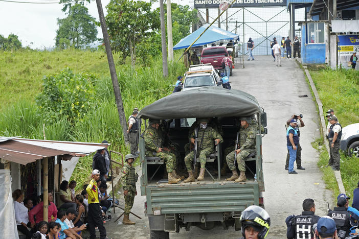 Soldiers patrol outside Bellavista prison where a deadly riot broke out overnight in Santo Domingo de los Tsachilas, Ecuador, on Monday.