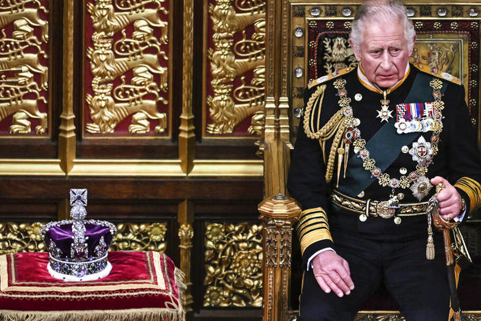 Britain's Prince Charles sits by the Imperial State Crown in the House of Lords on Tuesday during the opening of Parliament in London.