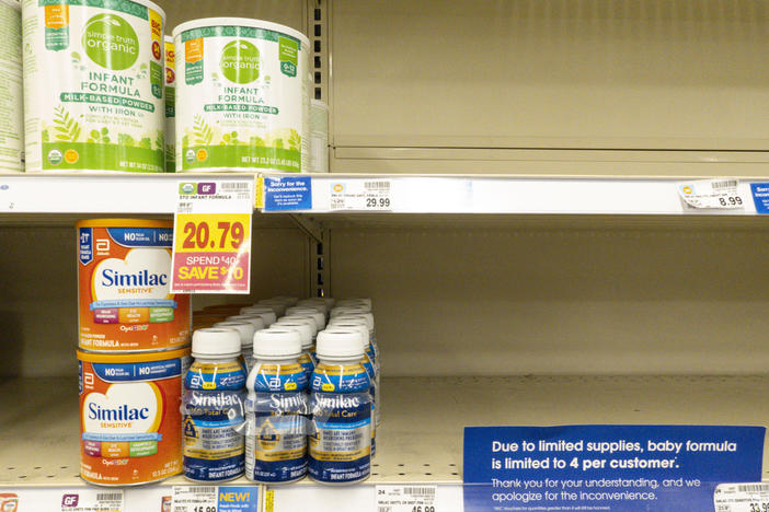 Baby formula is displayed on the shelves of a grocery store with a sign limiting purchases in Indianapolis on Tuesday.