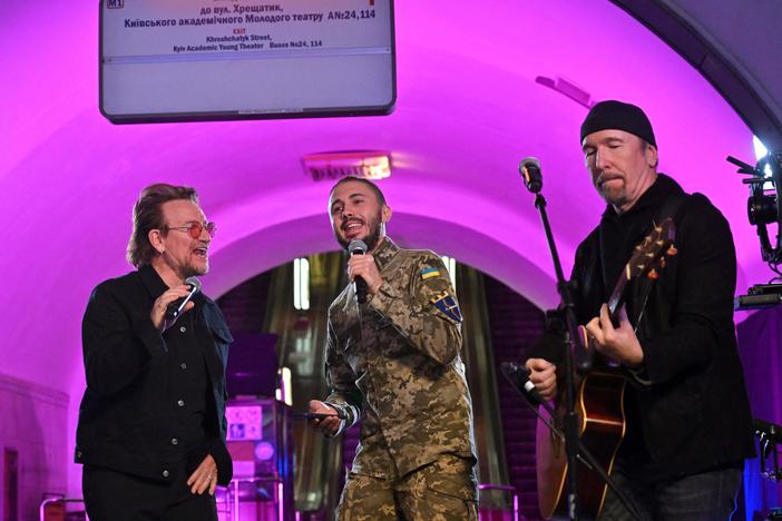 Bono, Taras Topolia and "The Edge" perform at a subway station-turned-bomb shelter in the Ukrainian capital of Kyiv on Sunday.