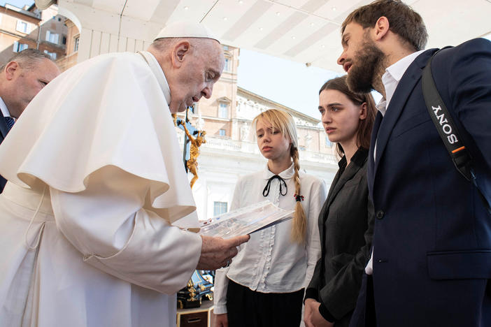 Wives of Ukrainian soldiers holed up inside the Azovstal steel plant in Mariupol meet with Pope Francis during the weekly general audience at the Vatican, Wednesday.