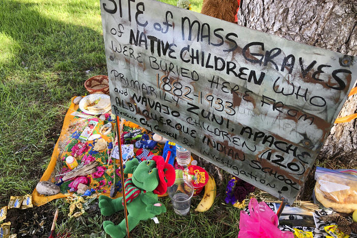 A makeshift memorial for the dozens of Indigenous children who died more than a century ago while attending a boarding school that was once located nearby is displayed under a tree at a public park in Albuquerque, N.M., in 2021.