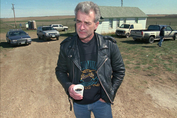 Randy Weaver, the object of the Ruby Ridge siege, visits with the media at the main FBI roadblock outside the Freemen compound in Montana on April 27, 1996. Weaver, who served as a spark for the growth of anti-government extremists, has died at the age of 74.