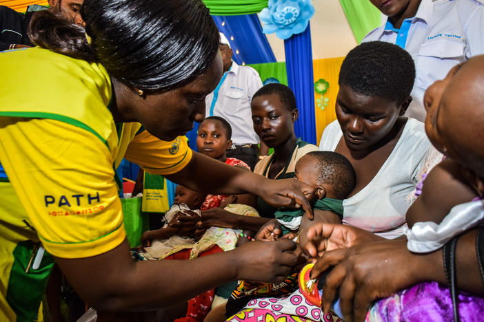 A health worker vaccinates a Kenyan child with the world's first malaria vaccine. Kenya has given at least one dose to 300,000 children so far.