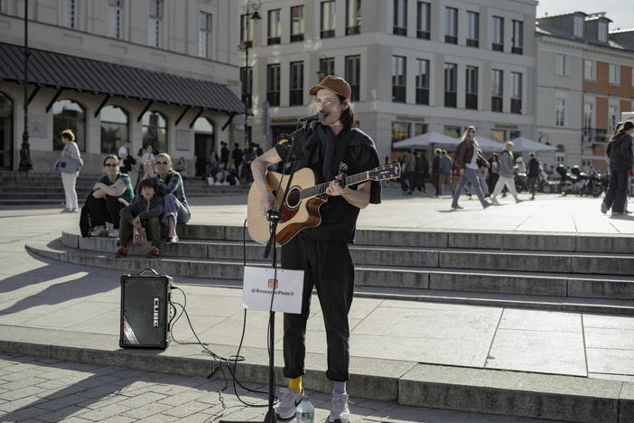 Roman Panchenko, from Chernihiv, performs in Castle Square in Warsaw, Poland, on Tuesday.