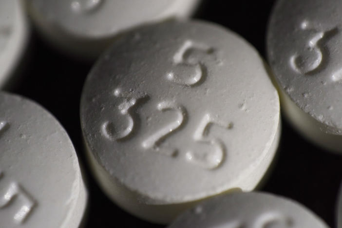 An arrangement of pills of the opioid oxycodone-acetaminophen in New York. Idaho officials on Friday agreed to a $119 million settlement with drugmaker Johnson & Johnson and three major distributors over their role in the opioid addiction crisis.