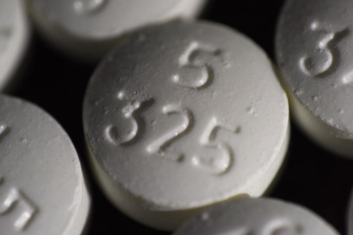 An arrangement of pills of the opioid oxycodone-acetaminophen in New York. Idaho officials on Friday agreed to a $119 million settlement with drugmaker Johnson & Johnson and three major distributors over their role in the opioid addiction crisis.