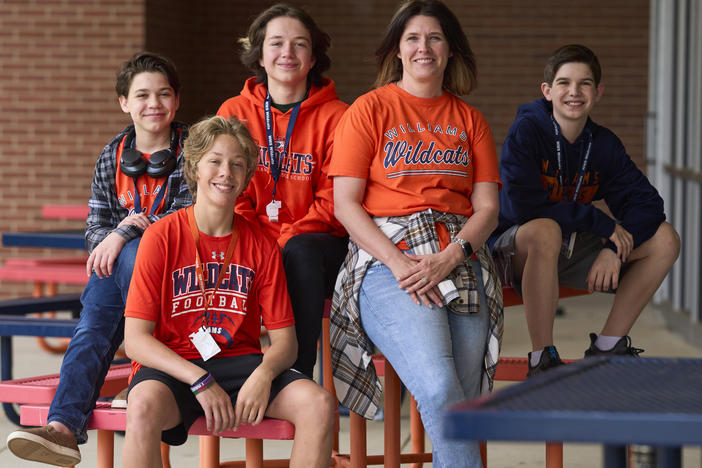 Middle school winners Harrison McDonald, Wesley Helmer, Kit Atteberry, and Blake Turkey pose with librarian Misti Knight.