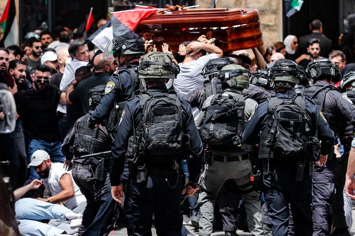 Israel's police chief orders an investigation into officers' conduct during Friday's funeral of Al Jazeera journalist Shireen Abu Akleh, who was killed while covering an Israeli arrest raid in a Palestinian refugee camp.
