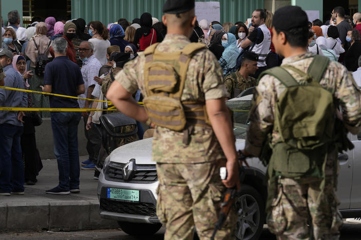 People line up to vote during parliamentary elections in Beirut, Lebanon Sunday, May 15, 2022.