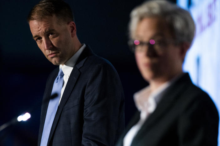 Oregon Treasurer Tobias Read participates in a debate with former state House Speaker Tina Kotek on March 18 in Portland, Ore. They are two of the top candidates for the Democratic Party's nomination in the Oregon governor's race.