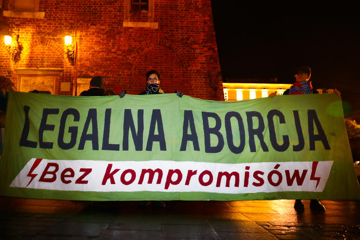 Demonstrators in Krakow, Poland, hold a banner reading "Legal Abortion Without Compromise" at a December 2021 protest. Poland has some of the most restrictive abortion laws in Europe.