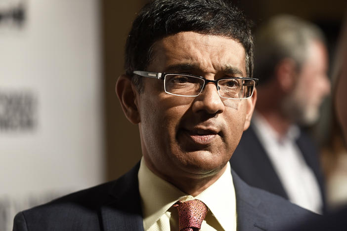 Dinesh D'Souza, seen here at a premiere of one of his films in 2018, has released a new film alleging voter fraud in the 2020 presidential election. Fact checkers have cast doubt on many of the film's claims.