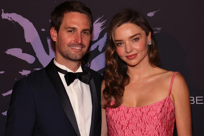 Snap CEO Evan Spiegel and KORA Organics CEO Miranda Kerr attend a gala in Beverly Hills, Calif., on May 4. The couple surprised graduates of a Los Angeles art school by paying off their student debt.