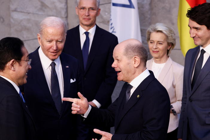 From left, Japan's Prime Minister Fumio Kishida, U.S. President Joe Biden and Germany's Chancellor Olaf Scholz speak as NATO Secretary General Jens Stoltenberg, back, European Commission President Ursula von der Leyen, and Canada's Prime Minister Justin Trudeau listen during a NATO summit on Russia's invasion of Ukraine in Brussels on March 24, 2022.