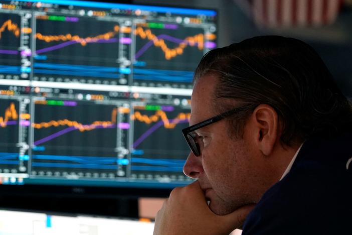 Traders work on the floor during the opening bell of the New York Stock Exchange in New York City on May 16. Stocks slumped on Wednesday as earnings from major retailers such as Target reinforced concerns about the U.S. economy.