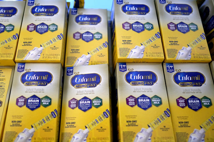 Infant formula made by a subsidiary of Reckitt is stacked on a table during a baby formula drive to help with the shortage on Saturday in Houston. The FDA announced a preliminary agreement with Abbott, a competitor, to restart production at a Michigan factory.