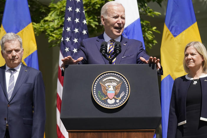 President Joe Biden, standing with Swedish Prime Minister Magdalena Andersson and Finnish President Sauli Niinisto, speaks in the Rose Garden of the White House on Thursday.
