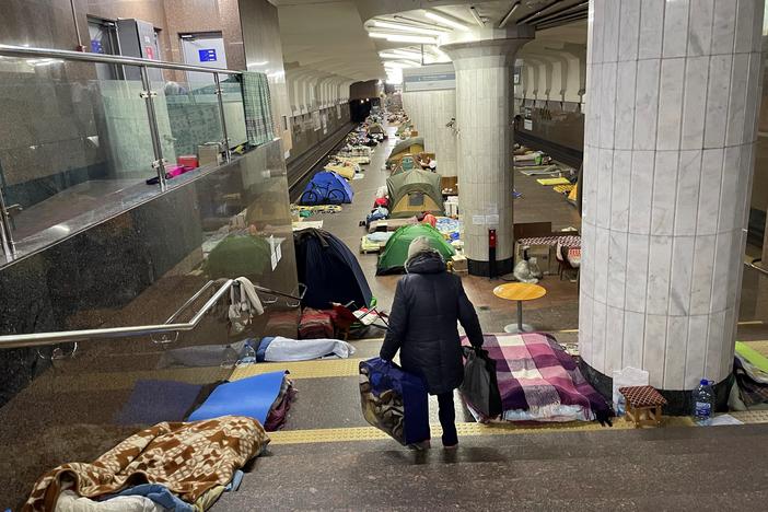 A woman walks through the Oleksiivska station in Kharkiv, Ukraine. Thousands of residents have been sheltering in the city's subway stations, but the mayor says it's safe to emerge now that Russian forces are retreating.