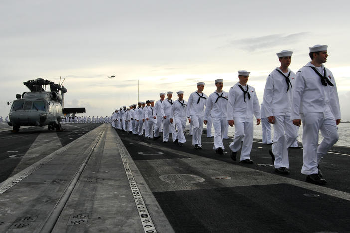 Sailors are seen aboard the USS George Washington in Yokosuka, Japan, in 2011. The U.S. Navy has seen a spike in desertions, with numbers more than doubling from 2019 to 2021. <em></em>