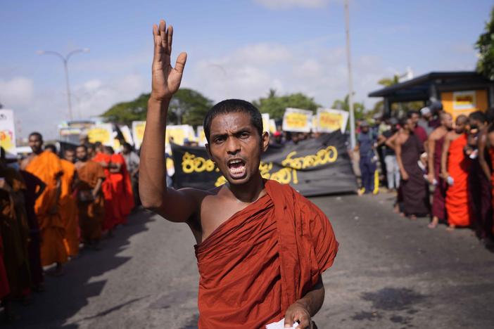 A student monk representing Inter University Students Federation shouts slogans during an anti government protest in Colombo, Sri Lanka, Thursday, May 19, 2022. Sri Lankans have been protesting for more than a month demanding the resignation of President Gotabaya Rajapaksa, holding him responsible for the country's worst economic crisis in recent memory.