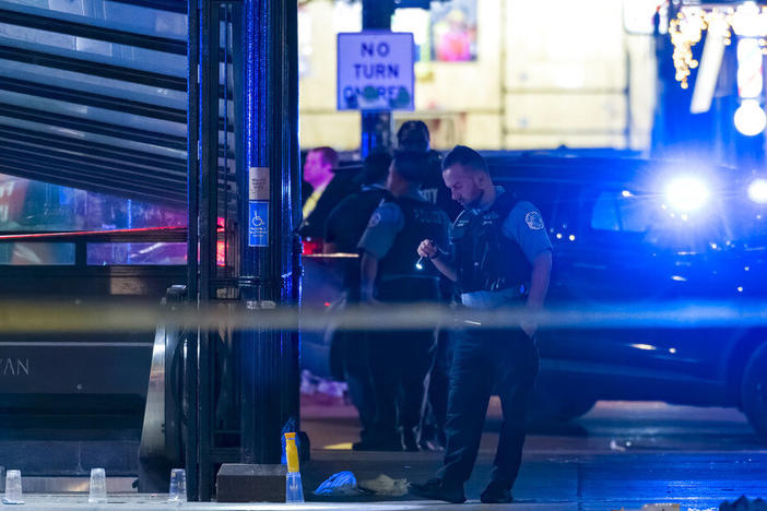Chicago police work at the scene of a shooting Thursday near East Chicago Avenue and North State Street in the Near North Side neighborhood.