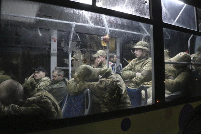 Ukrainian servicemen from the Azovstal steel plant sit on a bus near a penal colony, in Olyonivka, in territory under the government of the Donetsk People's Republic, on Friday.