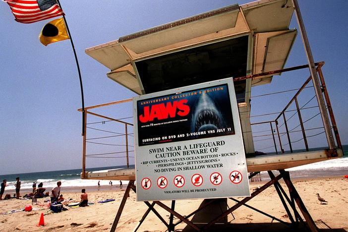 A poster advertising the anniversary collector's edition of the movie <em>Jaws</em> is posted on a lifeguard tower in 2000 on Zuma Beach in Malibu, Calif.