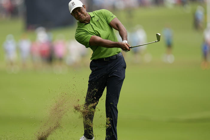 Tiger Woods hits from the rough on the second hole during the second round of the PGA Championship at Southern Hills Country Club on Friday in Tulsa, Okla.