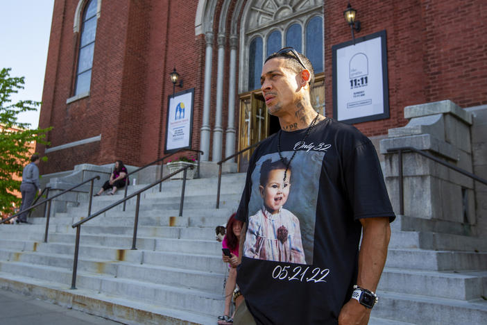 Enrique Owens, a cousin of Roberta Drury, wears a T-shirt with her photograph on it before her funeral service on Saturday in Syracuse, N.Y. Drury was one of 10 killed during a mass shooting at a supermarket last week in Buffalo.