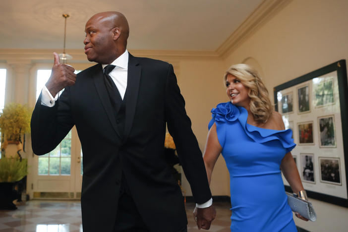 The University School of Milwaukee says it has filed a motion in court to dismiss a lawsuit filed by Craig and Kelly Robinson, the brother and sister-in-law of former first lady Michelle Obama. Here, they arrive at a state dinner at the White House in 2016.