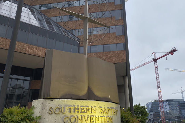 A cross and Bible sculpture stand outside the Southern Baptist Convention headquarters in Nashville, Tenn., on Tuesday. Top administrative leaders for the SBC said that they will release a secret list of hundreds of pastors and other church-affiliated personnel accused of sexual abuse.