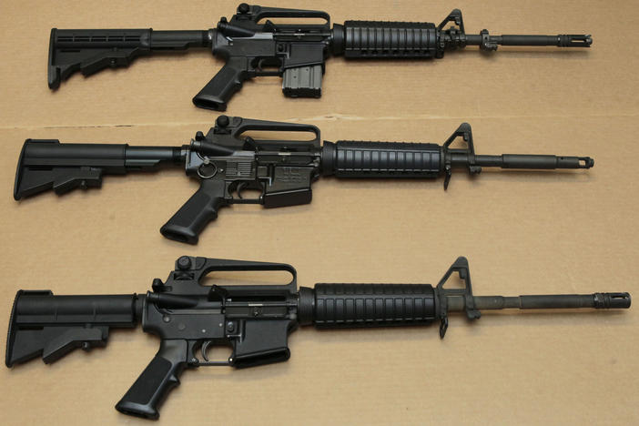 Texas Gov. Greg Abbott says the gunman responsible for the Uvalde shooting Tuesday used an AR-15-style assault rifle. Here, three variations of the AR-15 are displayed at the California Department of Justice in Sacramento, Calif., in 2012.