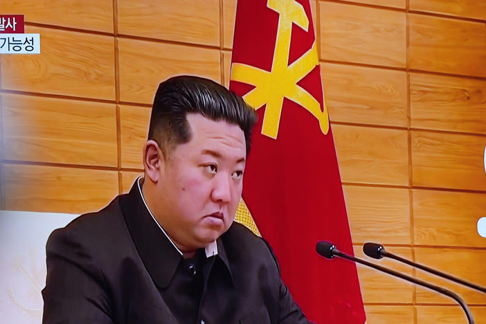 A TV screen shows a news program reporting about North Korea's missile launch with file footage of North Korean leader Kim Jong Un, at a train station in Seoul, South Korea, Wednesday, May 25, 2022.