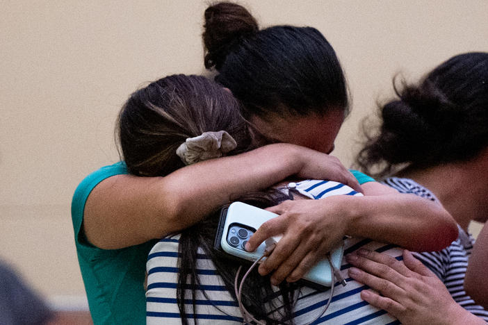 People mourn outside of the SSGT Willie de Leon Civic Center following the mass shooting at Robb Elementary School on Tuesday in Uvalde, Texas.